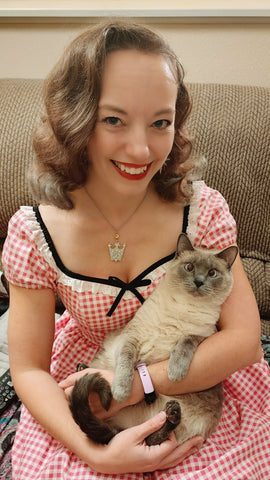 Pinup model and Hollyville owner, Pamela Marie with her bluepoint Siamese cat, Roxy.