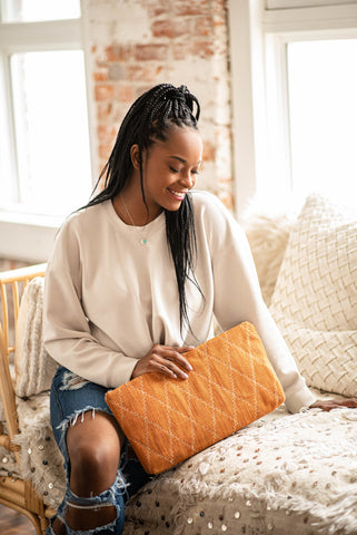 Black Woman Holding B.Eclectic Clutch Bag