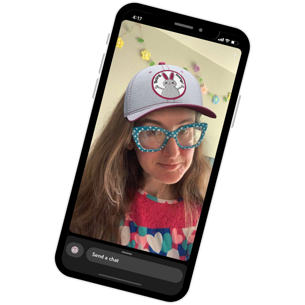 screenshot image of a woman with a Snapchat lens hat