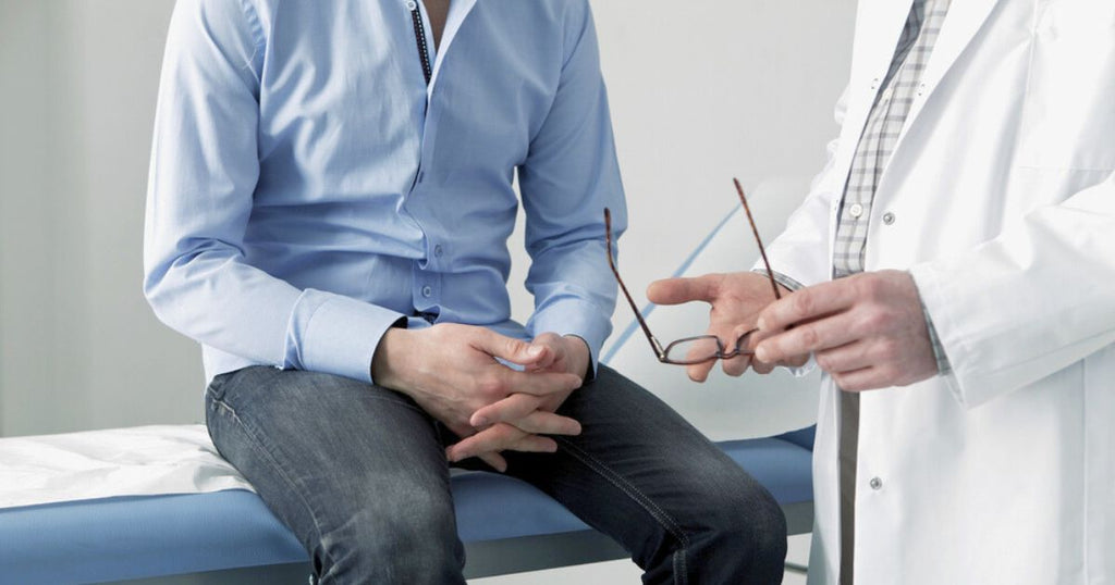 Man sitting in doctor's exam room