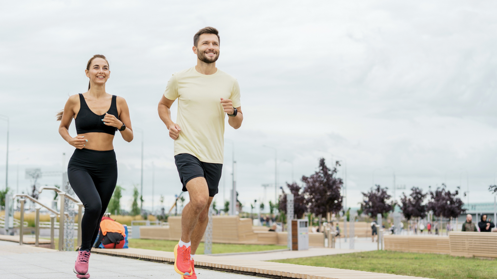 Happy man and woman running