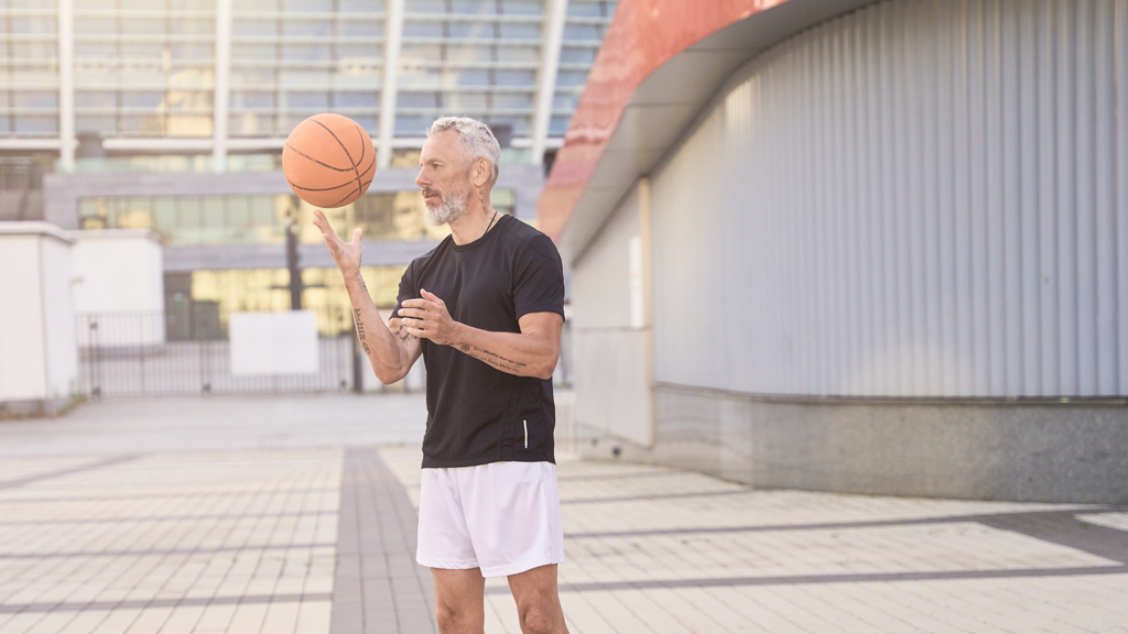 Older man playing basketball