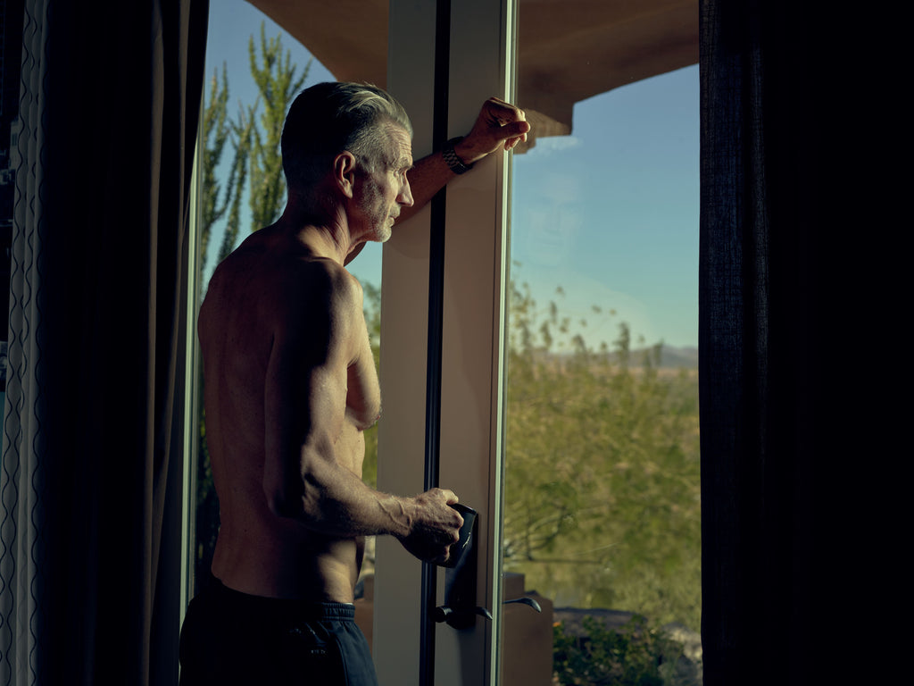 aging and cortisol levels - man looking out window