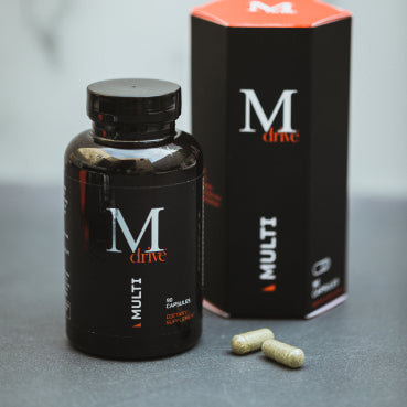 M Drive multivitamin box and bottle with two capsules shown