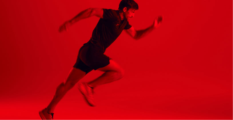 Man sprinting on a red background