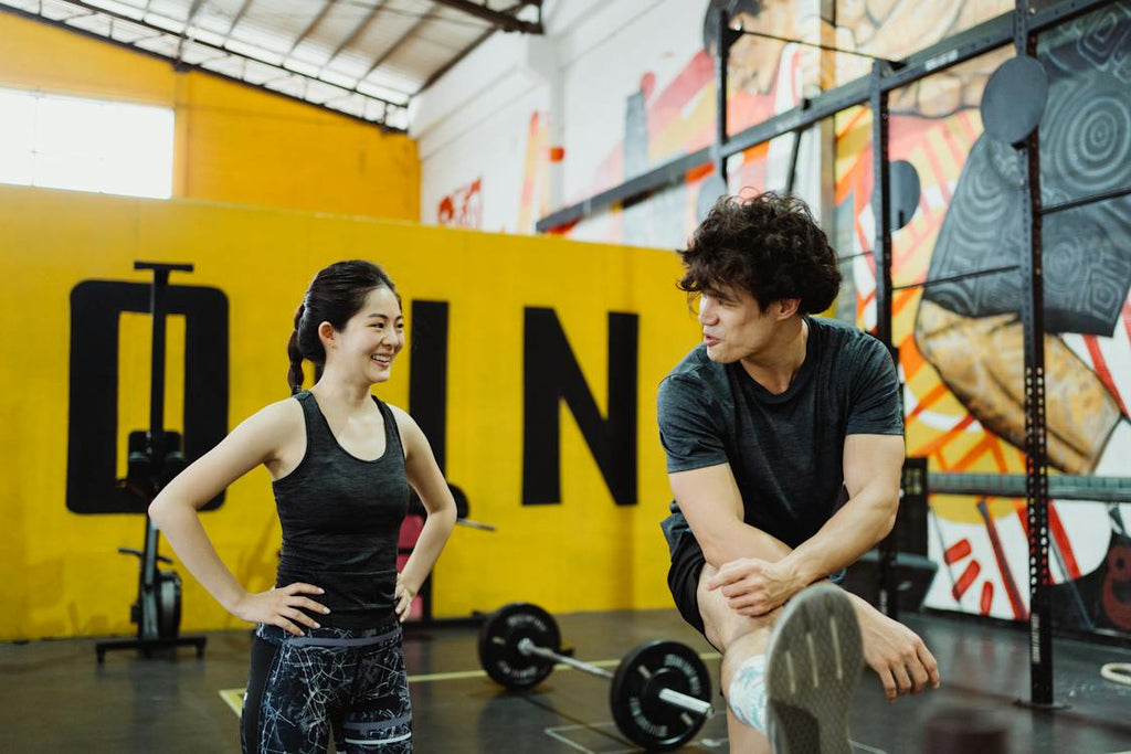 Man and woman talking at the gym