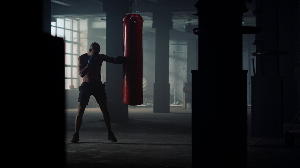 Man hitting punching bag | Testosterone to Help You Lose Weight?