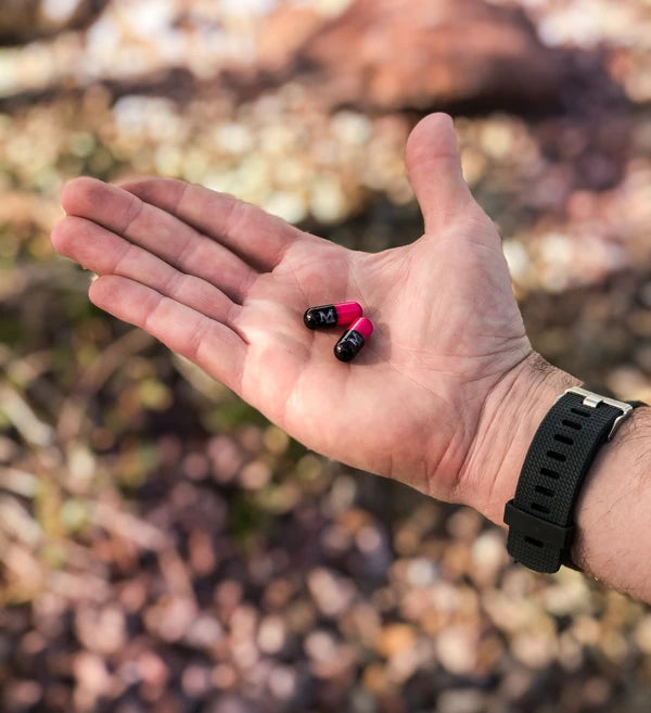 Hand holding Mdrive Capsules