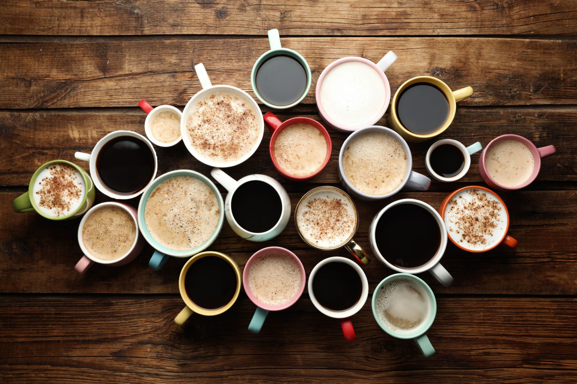 collection of hot coffee drinks on a wooden background