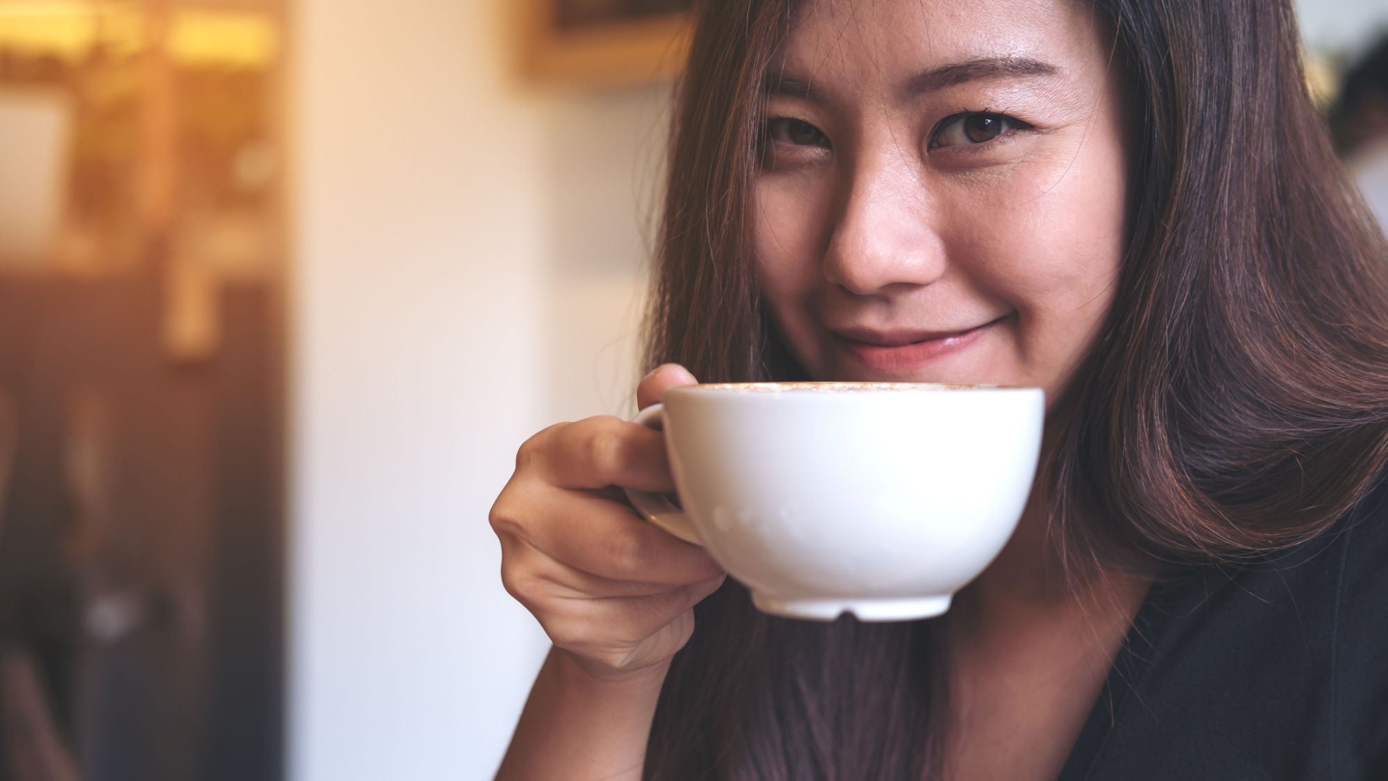 happy woman drinking coffee