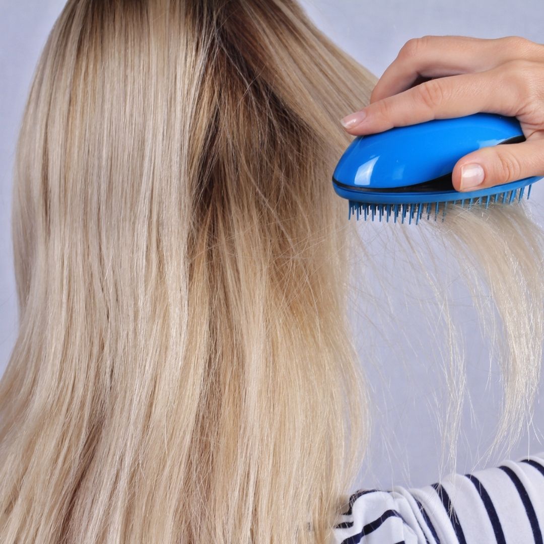 woman brushing her hair