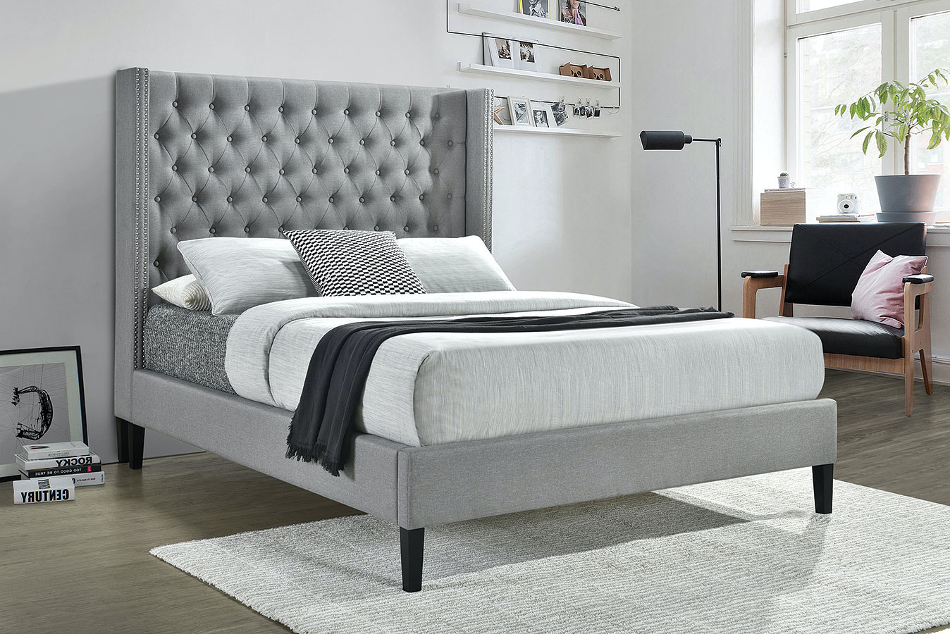 grey upholstered bed with studs