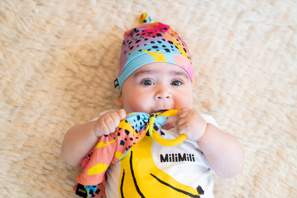 baby in pronoun by jesse tyler ferguson baby beanie with matching modern rainbow lovey and banana print milimili tshirt