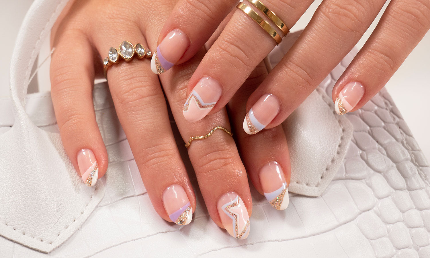 Beautiful model girl with a beige French manicure nail design with  rhinestones . Fashion makeup and care for hands and nails and cosmetics  Stock Photo | Adobe Stock