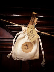Fabric pouch filled with a sweet treat and tied shut ready to open as you countdown