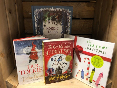 Image shows a collection of festive children's books featuring titles including Nordic Tales, Letters from Father Christmas, The Crayons' Christmas and The Girl Who Saved Christmas.