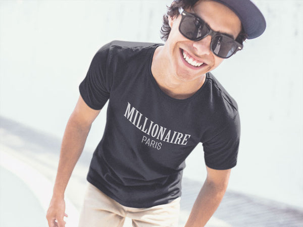 guy-wearing-a-t-shirt-smiling-at-a-skatepark - Millionaire Paris
