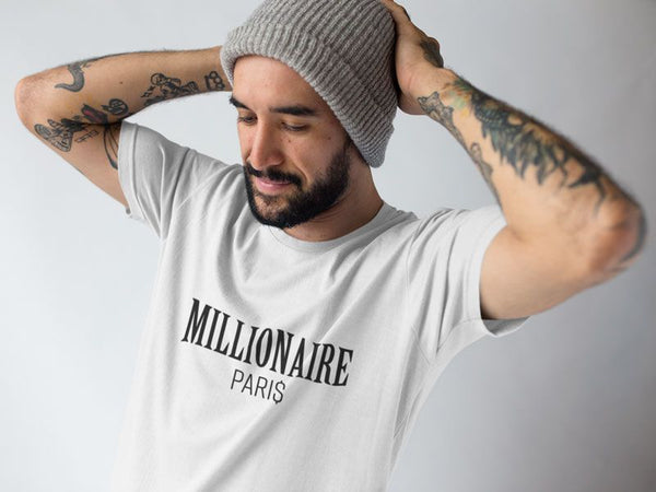 man-fixing-up-his-beanie-while-wearing-a-t-shirt-at-a-studio-Millionaire-Paris