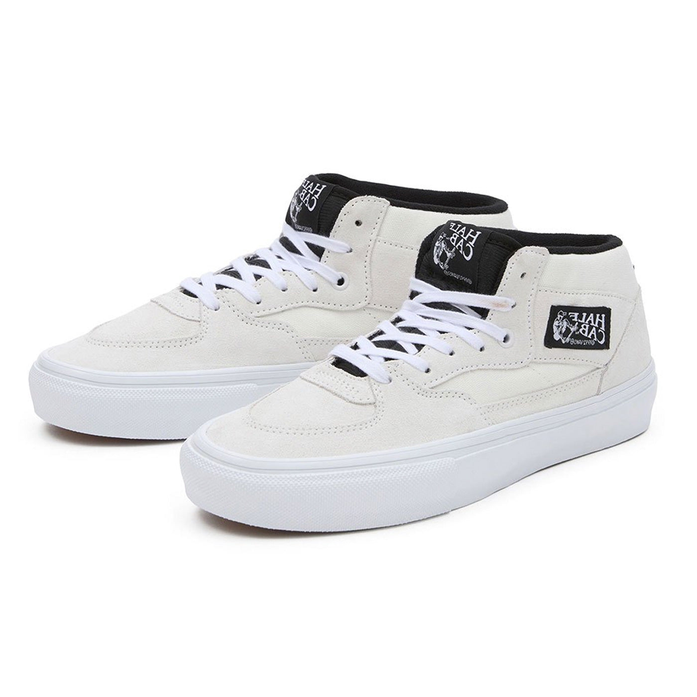 white half cab vans mid top laced skate shoes with white sole and black tongue. Free uk shipping over £50