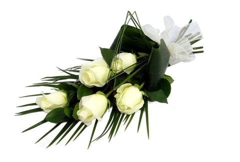 A hand-tied bunch of white roses
