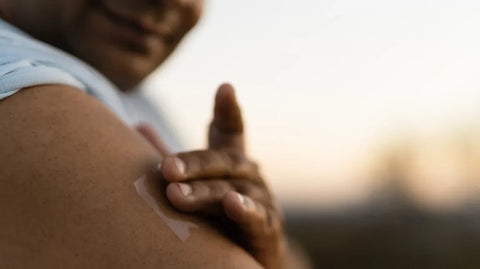 Man applying CBD Patch