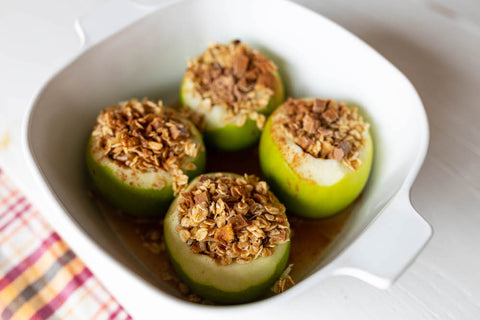 Apples stuffed with oats in a deep dish