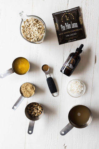 assorted ingredients in measuring spoons, Pine Pollen bar and Cacao bitters