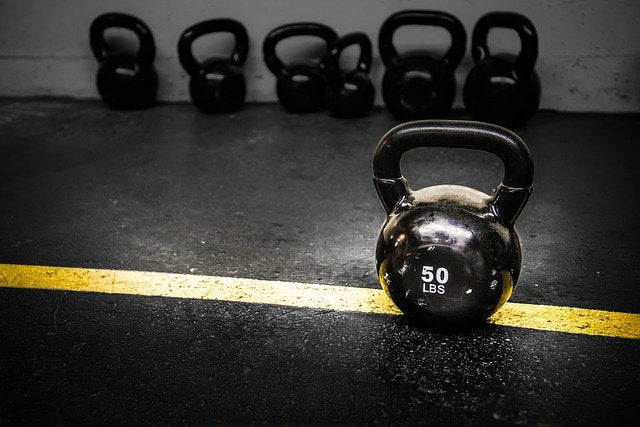 50 lbs dumbbell on dark floor