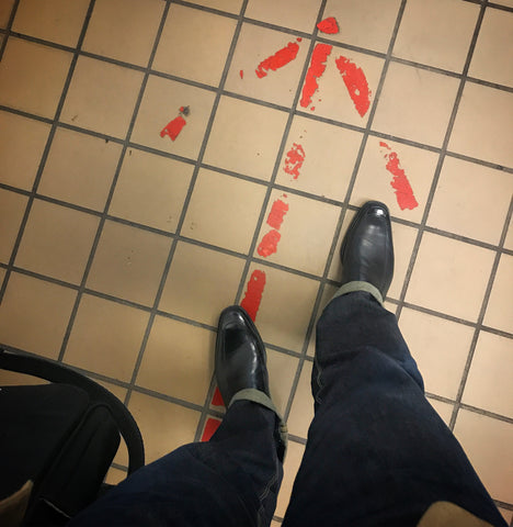 Magnanni loafers and red arrow at USPS