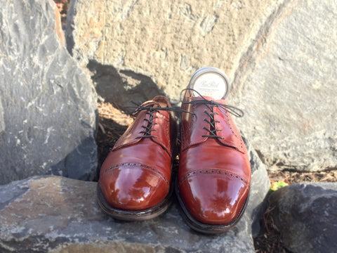 Lensing and Mirror Shining with High Shine and Black Wax derby shoes outdoors on the rocks