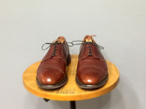 Post-lensing shoe shine Allen Edmonds Benton Walnut Calfskin Derbies indoors