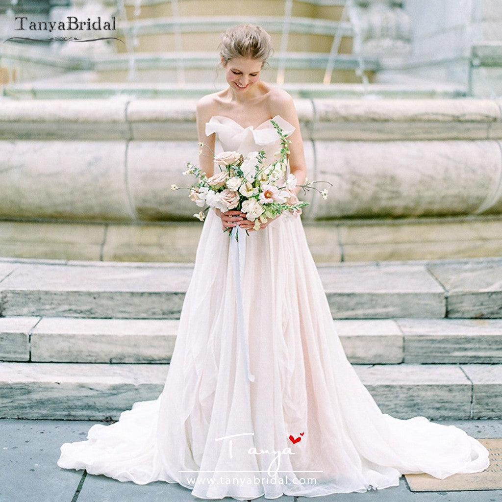 blush wedding dress with flowers