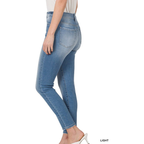 Jeans ajustados con tiro alto en los tobillos