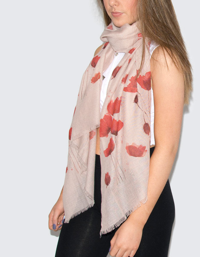 A photograph showing a red and white poppies scarf