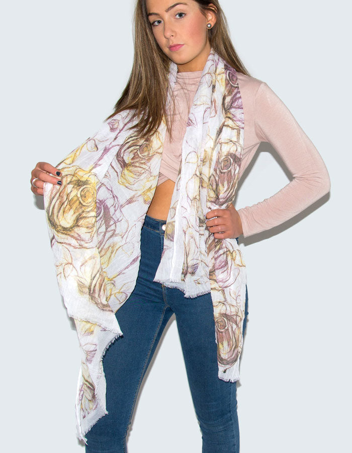 A photograph showing a purple and yellow tulips floral print scarf