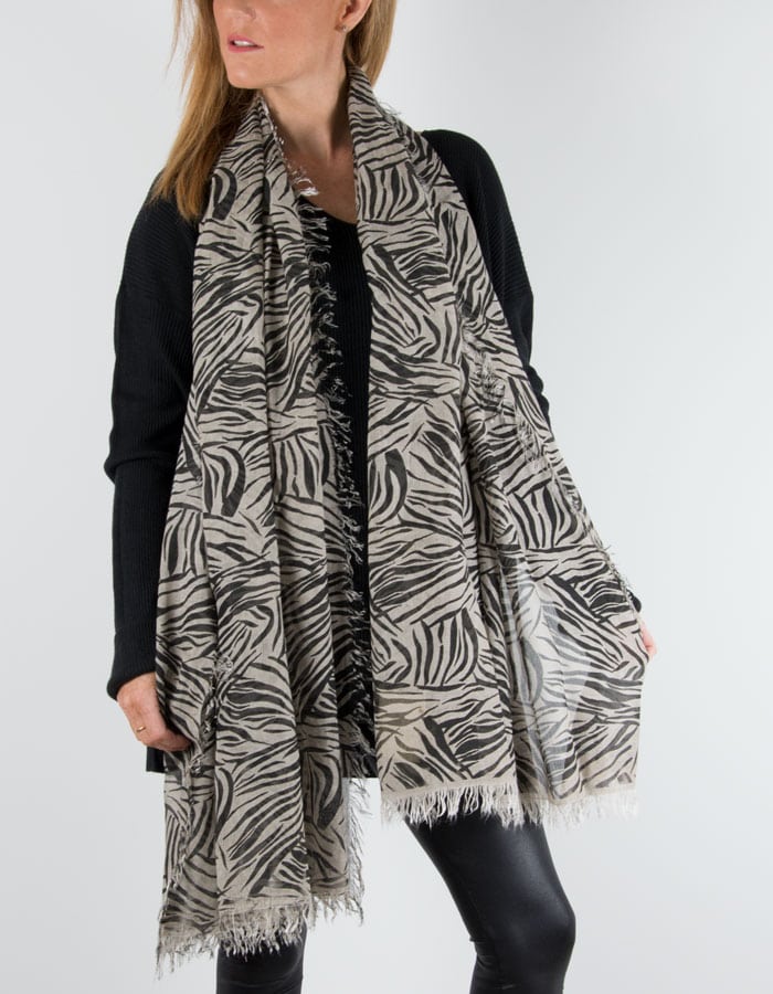 An image showing a zebra print beige and black scarf