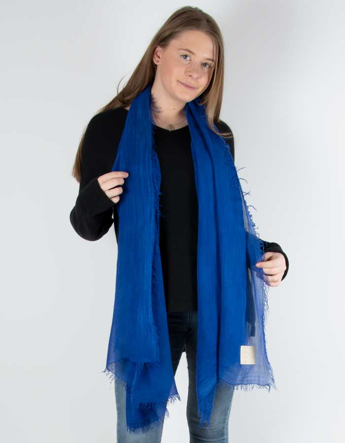 Scarf showing a blue fringed Italian MicroModal scarf