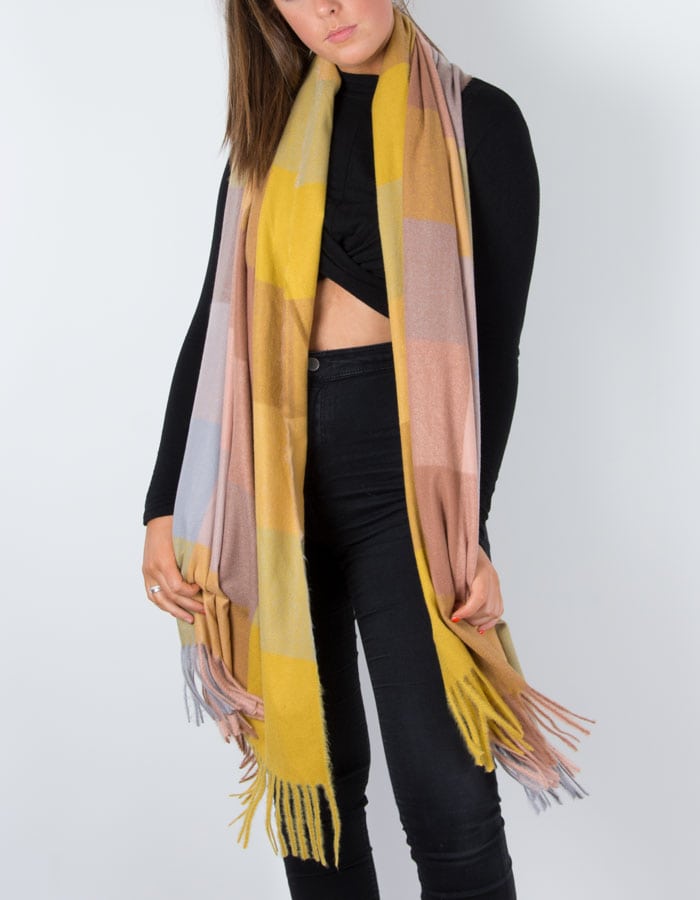 Image of a tartan scarf in mustard 