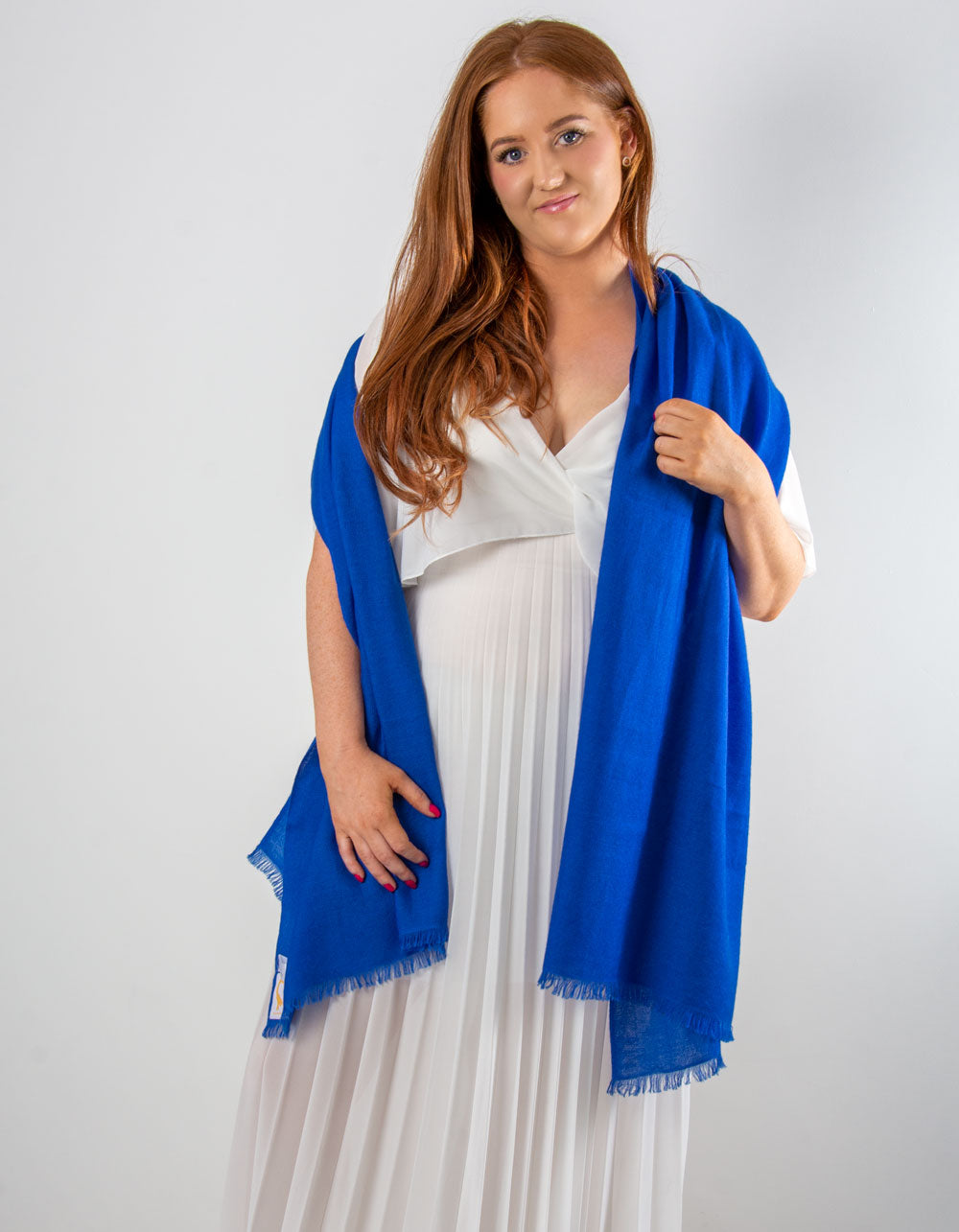 an image showing a cashmere wedding pashmina in cobalt