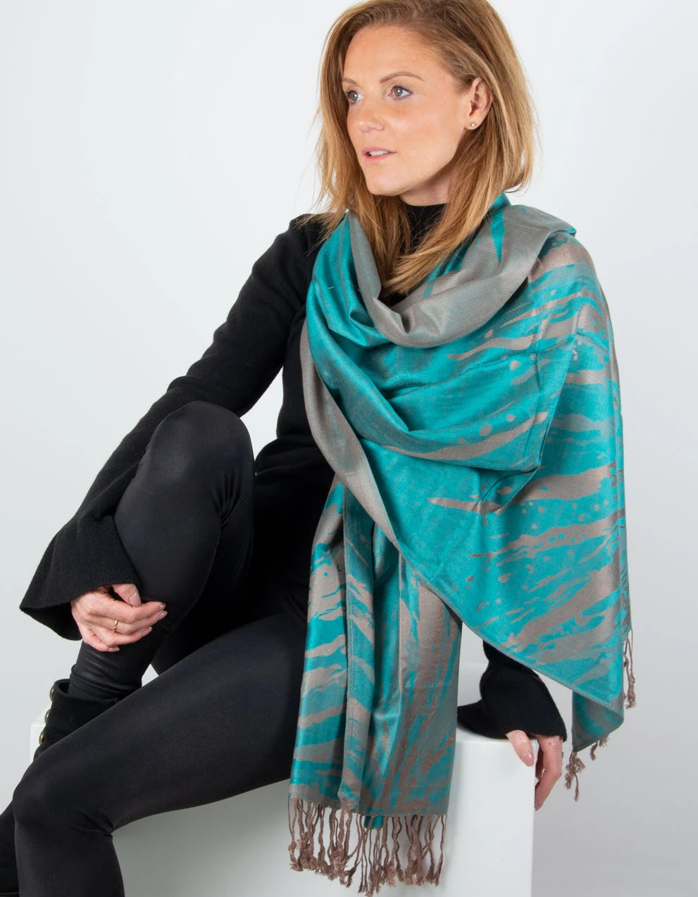 an image showing a green and bronze splash patterned pashmina
