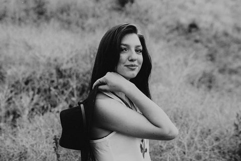 Graphic Style Tank top with Pacific Northwest Wildflowers on the front. Cute Wide Brim Hat. Field. Summer time. Golden Hour. Wearing white tank tops with jeans and jeans shorts. Summer time. Wenatchee, Washington. PNW Style. Pacific Northwest. Mountains. Mountain Style.