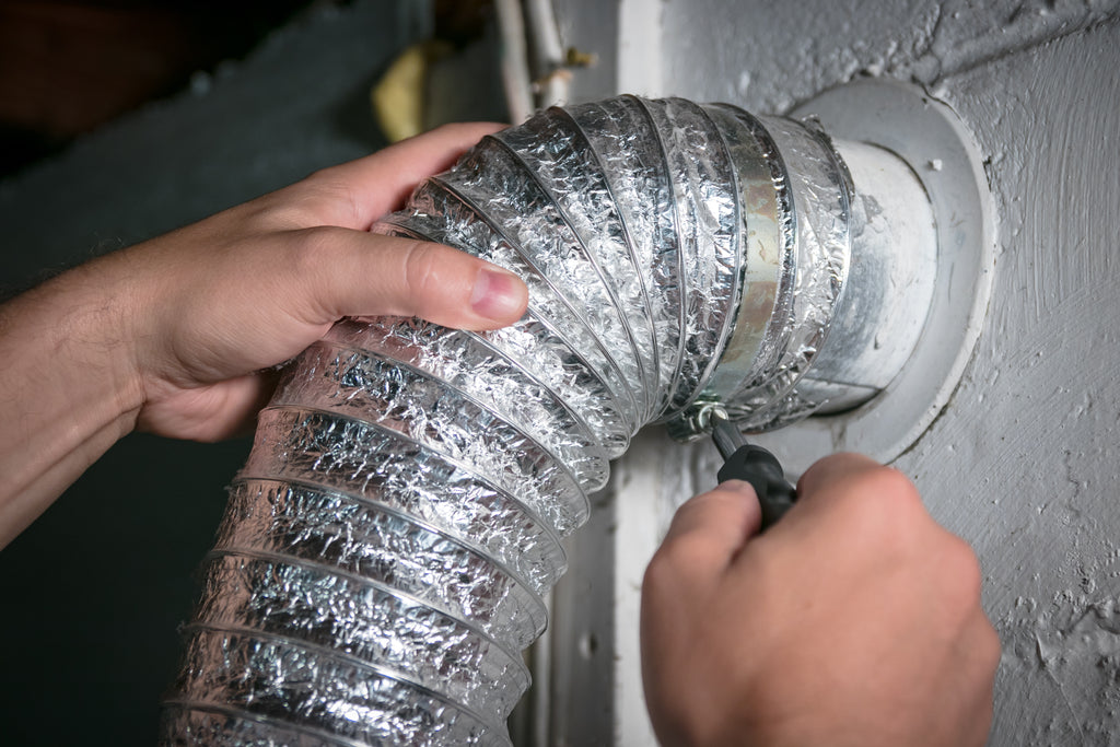 Attaching and detaching flexible hose from wall vent for dryer vent cleaning. Schröder USA