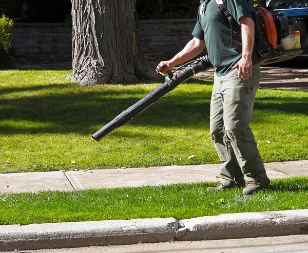 Landscaper with Leaf Blower on sidewalk. Schröder USA 