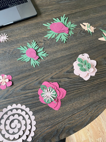 Paper flower pieces layer out by flower type