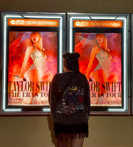 a picture of me wearing the sweatshirt at the Eras Tour Movie Premiere