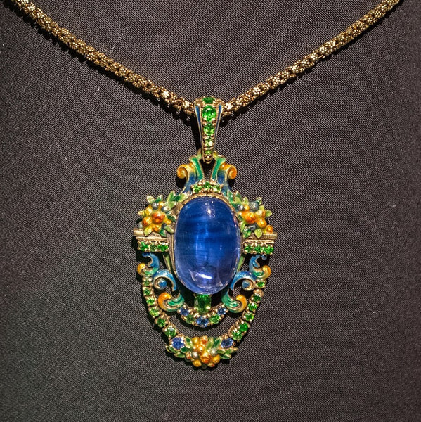 Necklace designed by Meta K. Overbeck for Tiffany & Co. Crafted some time in the 1920s, it is made of gold, cabochon sapphires, demantoid garnets, faceted sapphires, and enamel