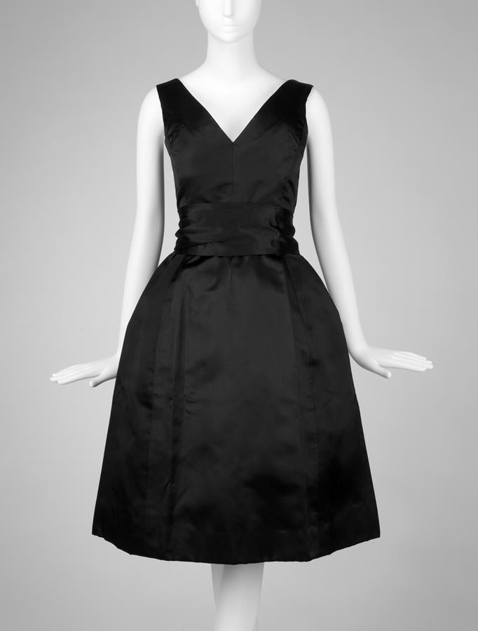 1954 Fall-Winter cocktail dress, Christian Dior, black silk satin with fringed sash.