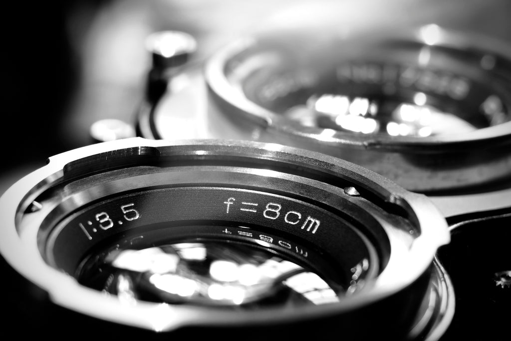 close up black and white photo of camera lens