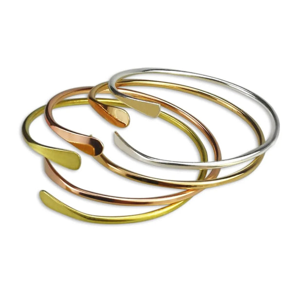 2023 fall jewelry trends mixed metals gold silver brass minimalist bangle bracelets