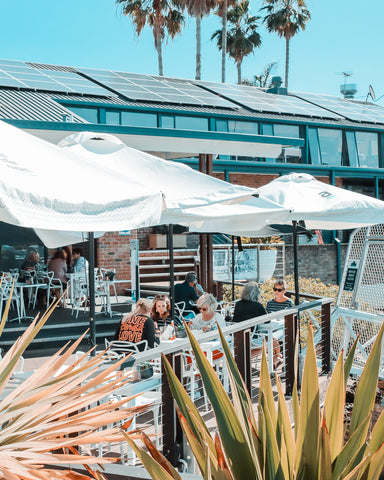 Outdoor seating at Seasalt Cafe and Restaurant in Port Macquarie which overlooks the marina. 